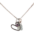 Necklace with heart-shaped pendant featuring a purple gemstone and gray stone on a white background
