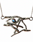 Silver necklace with a unique pendant on a white background