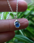 Sterling Silver boho necklace pendant with raw gemstone sapphire set in place. Irish handmade