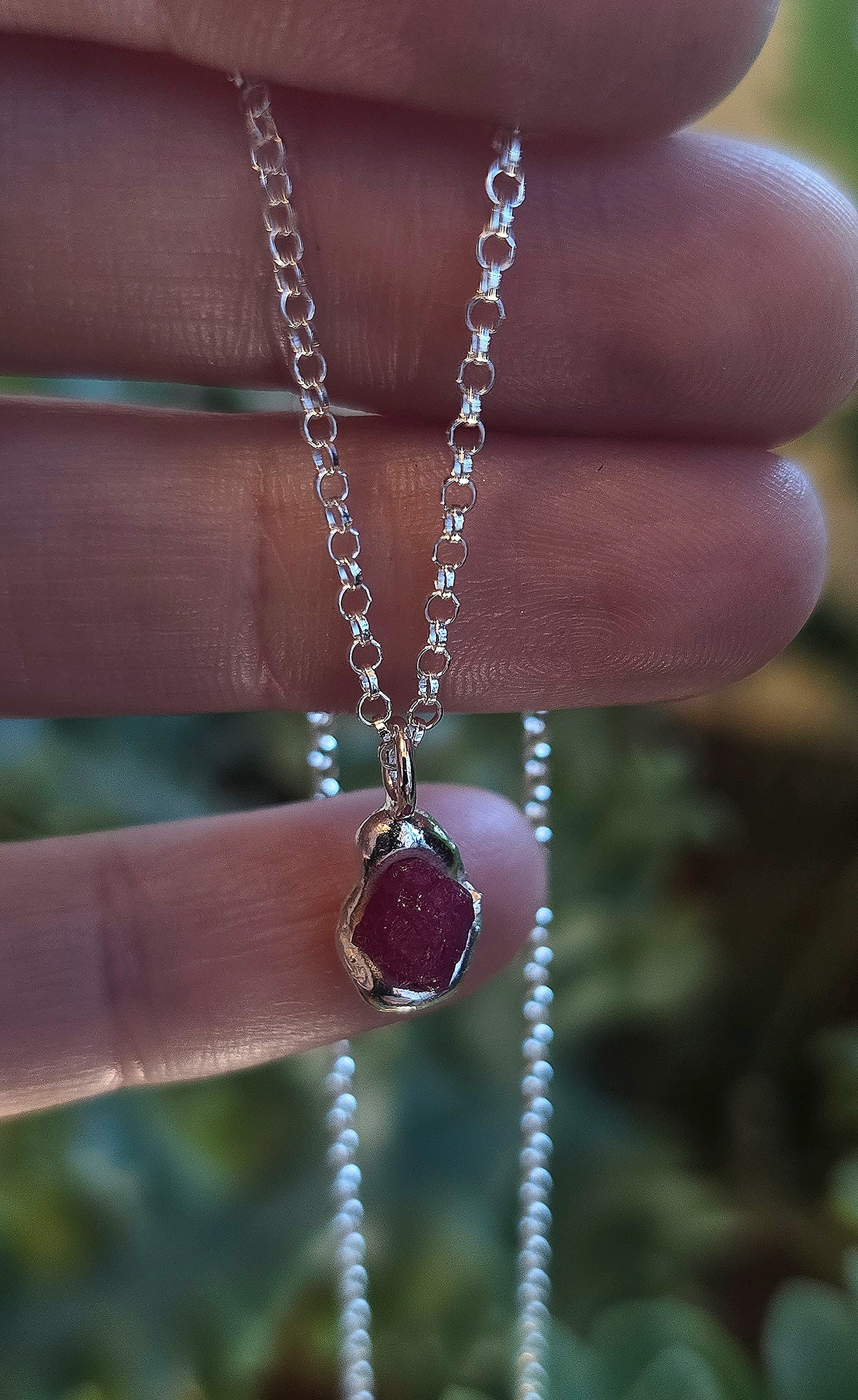 A beautiful bohemian Raw Ruby Pendant melted into sterling silver