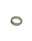 Silver ring on a light gray background