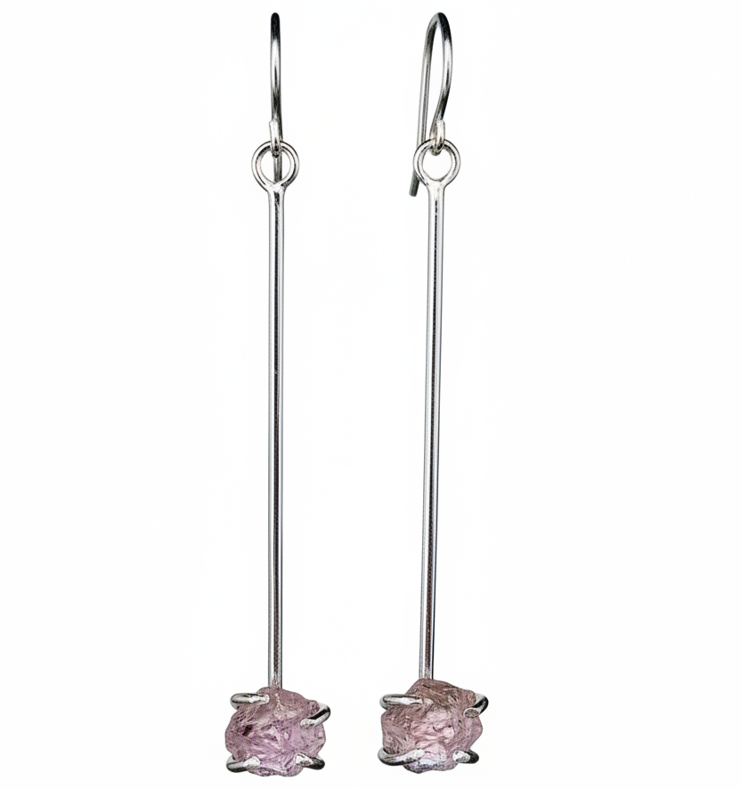 Pair of long earrings with raw ametrine gemstones on a white background